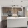 kitchen with an island, modern appliances and spacious counter-space