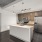 kitchen with an island, modern appliances and spacious counter-space