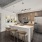 kitchen with an island, modern appliances and spacious counter-space