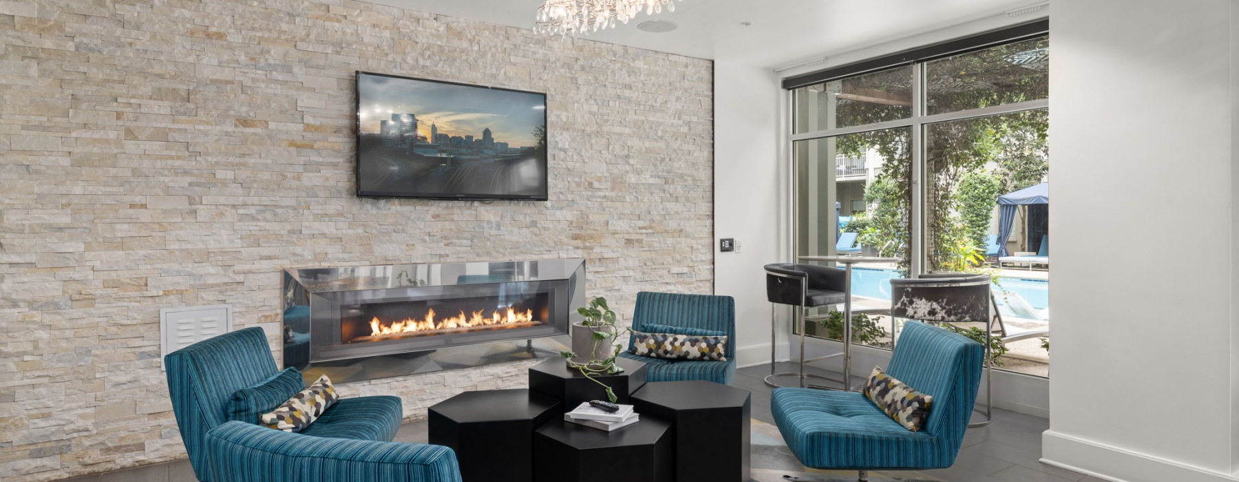 living room space with fireplace and tv